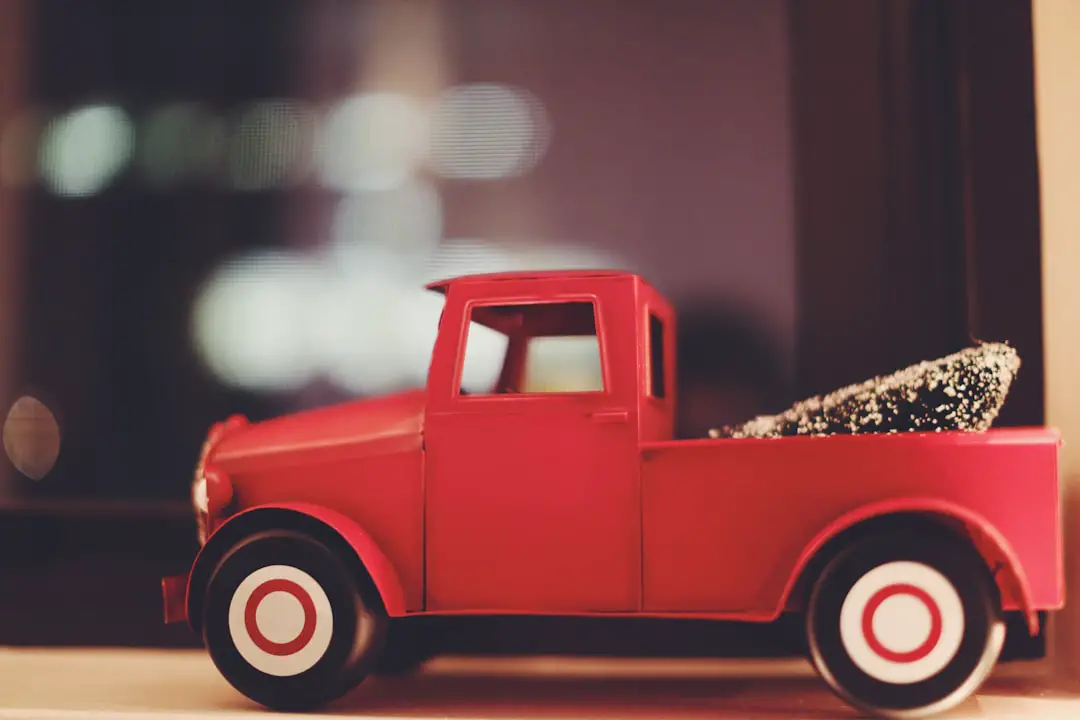 red toy car on white surface