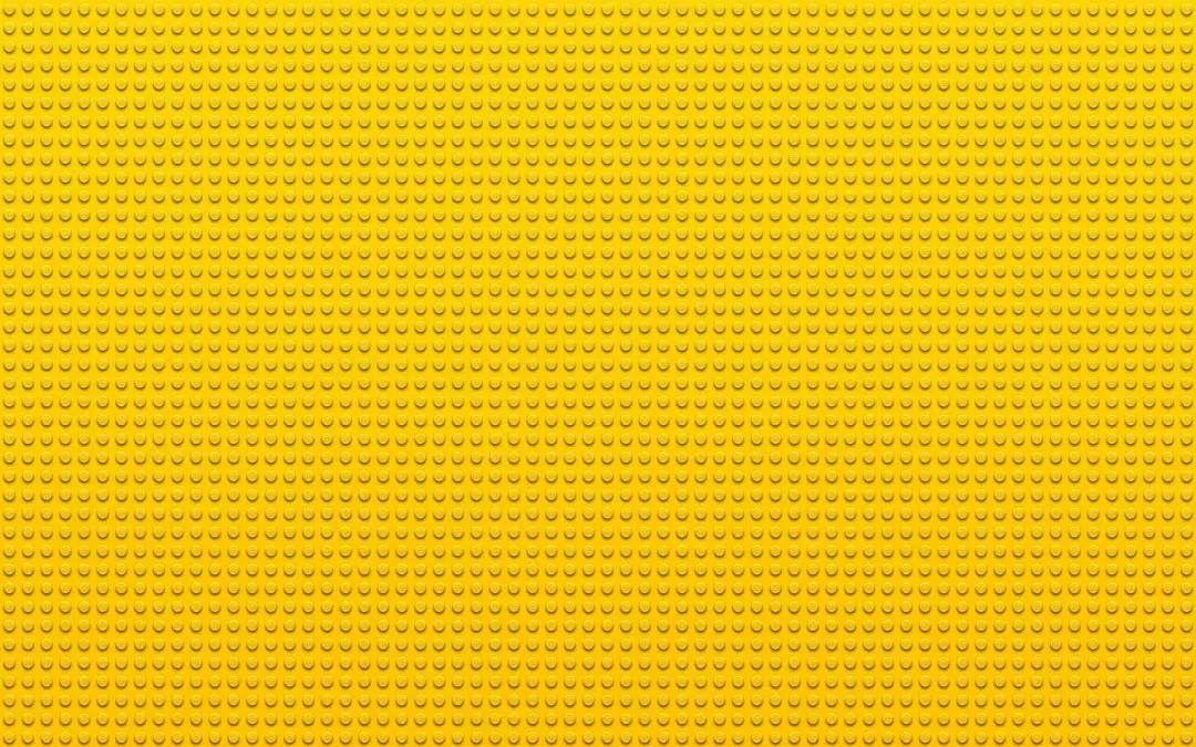 a yellow background with small dots