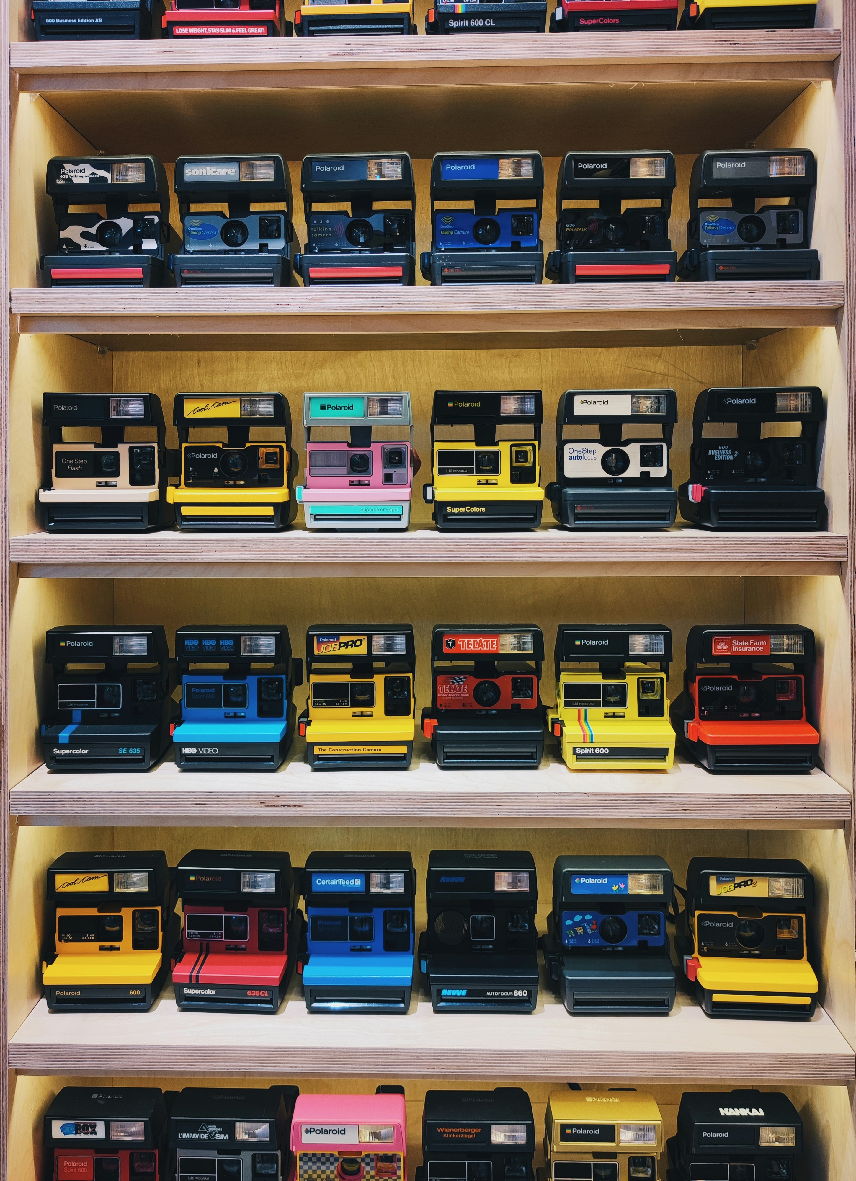 a shelf filled with lots of different types of electronic devices